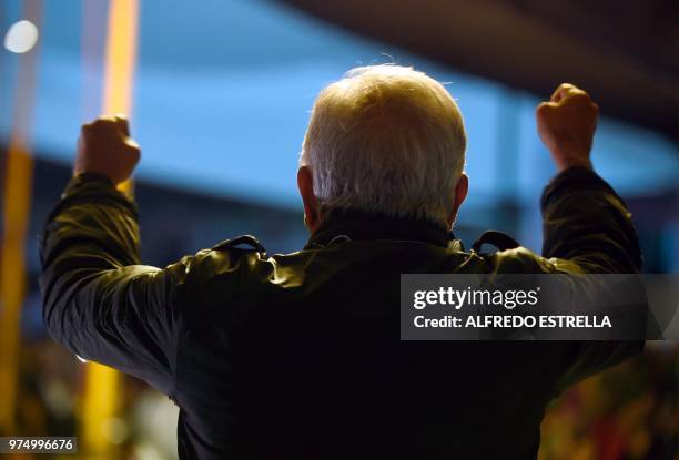 Mexican presidential candidate for the MORENA party, Andres Manuel Lopez Obrador cheers his supporters, during a campaign rally in Chimalhuacan,...