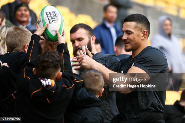 Sonny Bill Williams and Liam Coltman interact with fans during the New Zealand All Blacks Captain's Run at Westpac Stadium on June 15, 2018 in...