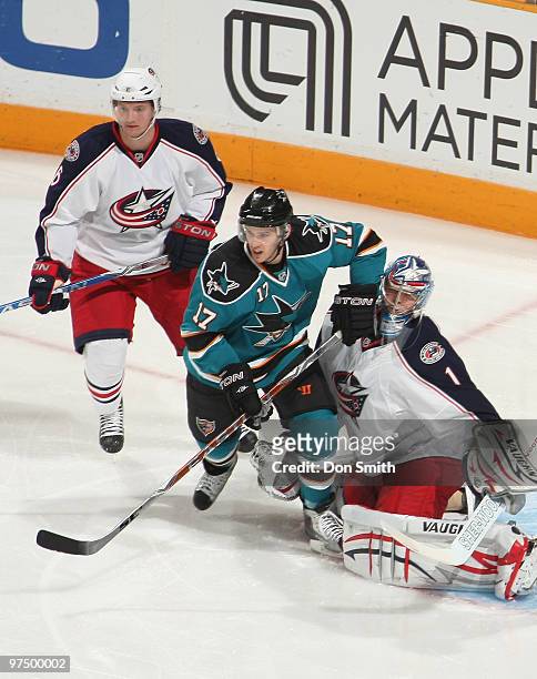 Anton Stralman and Steve Mason of the Columbus Blue Jackets battle with Torrey Mitchell of the San Jose Sharks during an NHL game on March 6, 2010 at...