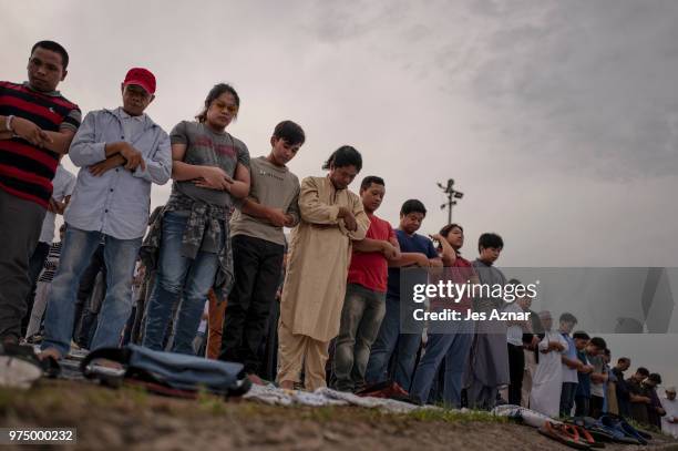 Filipino Muslims flock to a public park to attend prayers and celebrate Eid al-Fitr on June 15, 2018 in Manila, Philippines. Muslims around the world...