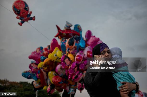 Filipino Muslims flock to a public park to attend prayers and celebrate Eid al-Fitr on June 15, 2018 in Manila, Philippines. Muslims around the world...