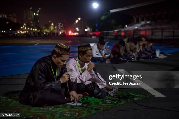 Filipino Muslims flock to a public park to attend prayers and celebrate Eid al-Fitr on June 15, 2018 in Manila, Philippines. Muslims around the world...