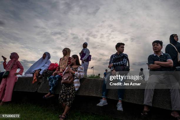 Filipino Muslims flock to a public park to attend prayers and celebrate Eid al-Fitr on June 15, 2018 in Manila, Philippines. Muslims around the world...