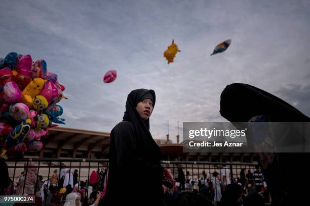 Filipino Muslims flock to a public park to attend prayers and celebrate Eid al-Fitr on June 15, 2018 in Manila, Philippines. Muslims around the world...