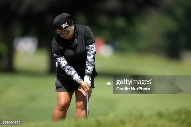 Christina Kim of the United States hits out of the rough toward the 8th green during the first round of the Meijer LPGA Classic golf tournament at...