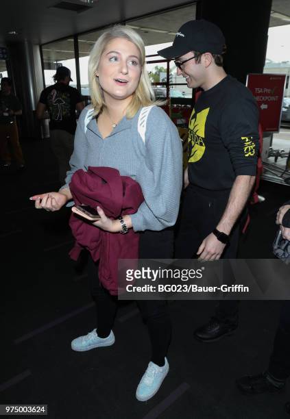 Daryl Sabara and Meghan Trainor are seen at LAX on June 14, 2018 in Los Angeles, California.