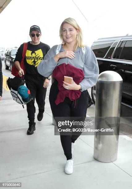 Daryl Sabara and Meghan Trainor are seen at LAX on June 14, 2018 in Los Angeles, California.