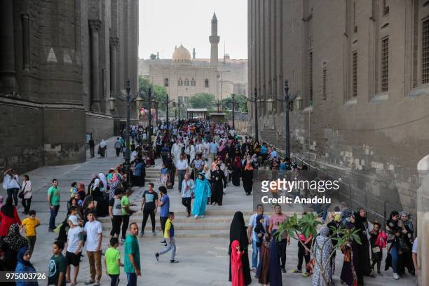 Muslims arrive to perform Eid al-Fitr prayer at Mosque-Madrassa of Sultan Hassan in Cairo, Egypt on June 15, 2018. Eid al-Fitr is a religious holiday...