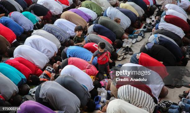 Muslims perform Eid al-Fitr prayer at Mosque-Madrassa of Sultan Hassan in Cairo, Egypt on June 15, 2018. Eid al-Fitr is a religious holiday...