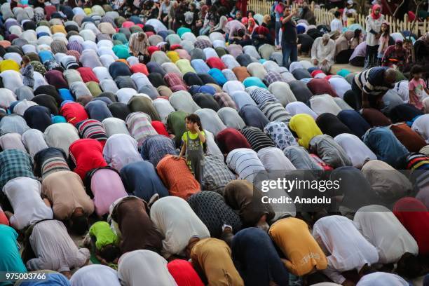 Muslims perform Eid al-Fitr prayer at Mosque-Madrassa of Sultan Hassan in Cairo, Egypt on June 15, 2018. Eid al-Fitr is a religious holiday...