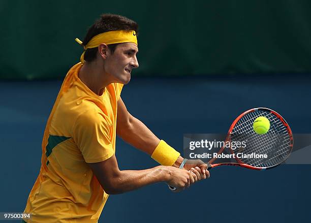 Bernard Tomic of Australia plays a backhand in his match against Hsin-Han Lee of Chinese Taipei during day three of the Davis Cup Asia-Oceania Zone...