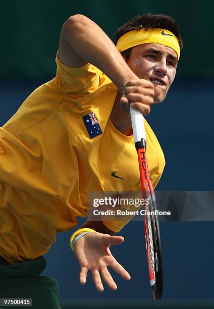 Bernard Tomic of Australia serves in his match against Hsin-Han Lee of Chinese Taipei during day three of the Davis Cup Asia-Oceania Zone Group 1 tie...