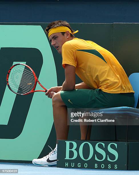 Bernard Tomic of Australia takes a break in his match against Hsin-Han Lee of Chinese Taipei during day three of the Davis Cup Asia-Oceania Zone...