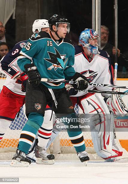 Marc Methot and Steve Mason of the Columbus Blue Jackets defend against Dany Heatley of the San Jose Sharks during an NHL game on March 6, 2010 at HP...