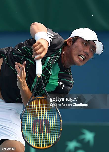 Hsin-Han Lee of Chinese Taipei serves in his match against Bernard Tomic of Australia during day three of the Davis Cup Asia-Oceania Zone Group 1 tie...