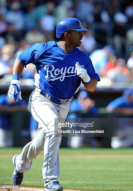 Alberto Callaspo of the Kansas City Royals runs to first base during a Spring Training game against the Texas Rangers on March 6, 2010 in Surprise,...
