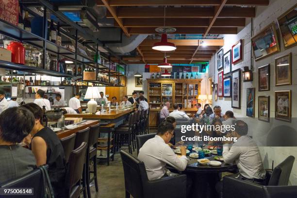 Customers dine at Ola Cocina del Mar in Singapore, on Thursday, June 7, 2018. Singapore is one of most exciting cities in Asia for food, with a...