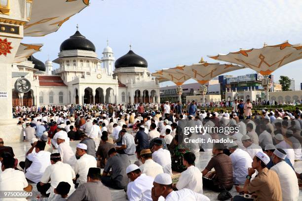 Muslims perform Eid al-Fitr prayer at Baiturrahman Grand Mosque, Aceh, Indonesia on June 15, 2018. Eid al-Fitr is a religious holiday celebrated by...