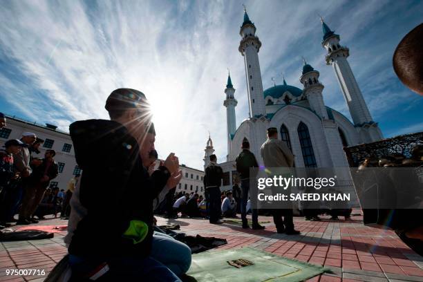 Tatar Muslims offer their Eid al-Fitr prayers at the Qolsarif mosque in Kazan on June 15 at the end of the holy month of Ramadan.
