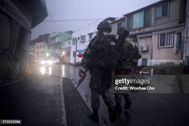 Soldiers patrol near Daejin port on June 10, 2018 in Hyeonnae, South Korea. Around 2,700 South Korean villagers live under tight military defense at...