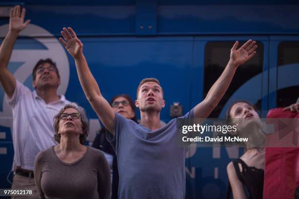 People call "you are not alone" to immigrant detainees inside the Metropolitan Detention Center during a protest of the Trump administration policy...