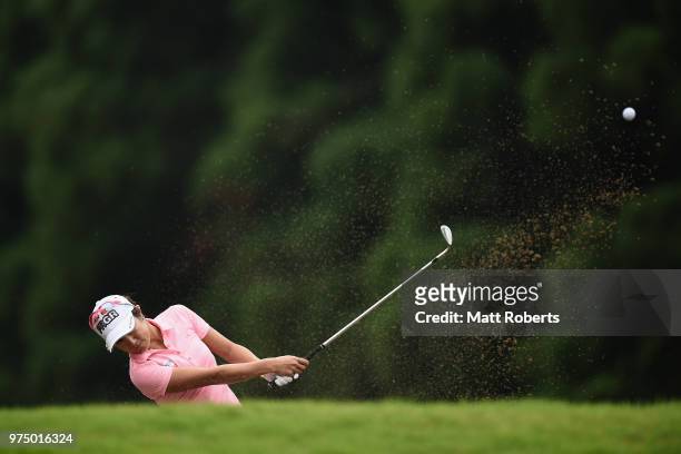 Asako Fujimoto of Japan hits out of the bunker on the 1st hole during the first round of the Nichirei Ladies at the Sodegaura Country Club Shinsode...