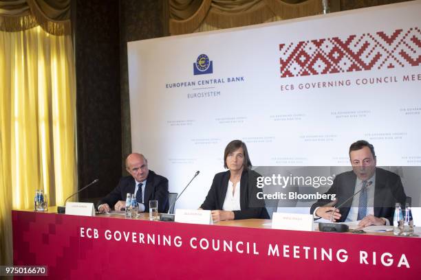 Mario Draghi, president of the European Central Bank , right, speaks on a panel with Zoja Razmusa, deputy governor of the Bank of Latvia, center, and...