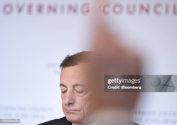 Mario Draghi, president of the European Central Bank , pauses as a journalist raises their hand during the European Central Bank rate decision at the...