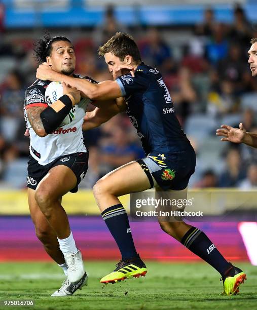 James Gavet of the Warriors is tackled by Sam Hoare of the Cowboys during the round 15 NRL match between the North Queensland Cowboys and the New...