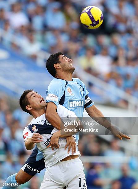 John Aloisi of Sydney and Rodrigo Vargas of the Victory compete for a header during the A-League Major Semi Final match between Sydney FC and...