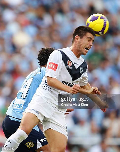 Rodrigo Vargas of the Victory heads the ball in front of Alex Brosque of Sydney during the A-League Major Semi Final match between Sydney FC and...