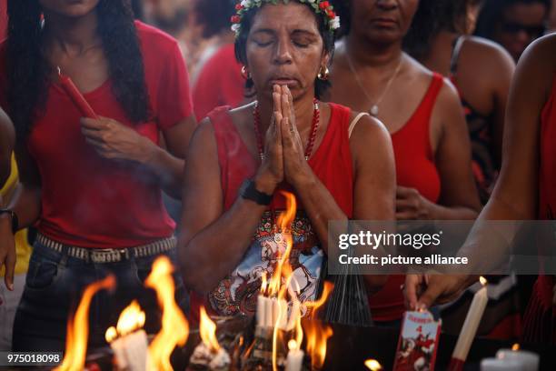 April 2018, Brazil, Rio de Janeiro: Believers praying on the Day of Holly Saint Georg. "Sao Jorge" , referred to as "Ogum" in the afro-brazlilian...
