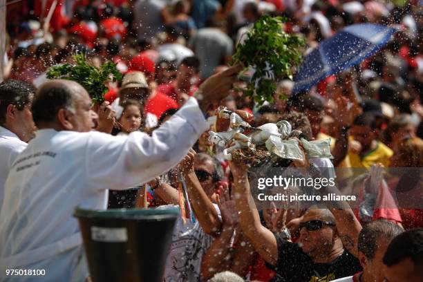 April 2018, Brazil, Rio de Janeiro: Clerics bless worshipers on the 'Sao Jorge's Day' . 'Sao Jorge', also known as Ogum in the afro-Brazilian Umbanda...