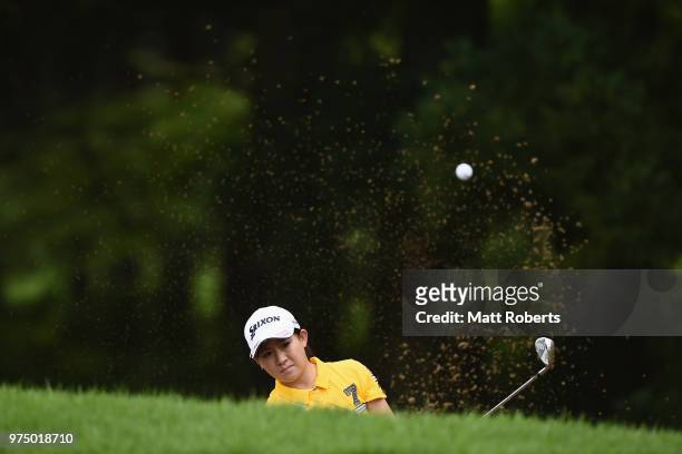 Kotono Kozuma of Japan hits out of the bunker on the 1st hole during the first round of the Nichirei Ladies at the Sodegaura Country Club Shinsode...