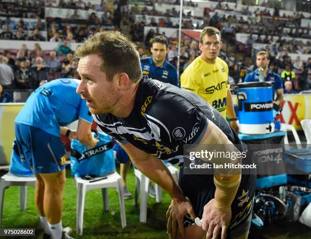 Michael Morgan of the Cowboys comes from the field after being injured during the round 15 NRL match between the North Queensland Cowboys and the New...