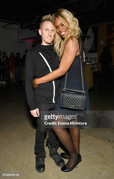 Kyle Draper and Laverne Cox attend MAC Cosmetics Aaliyah Launch Party on June 14, 2018 in Hollywood, California.