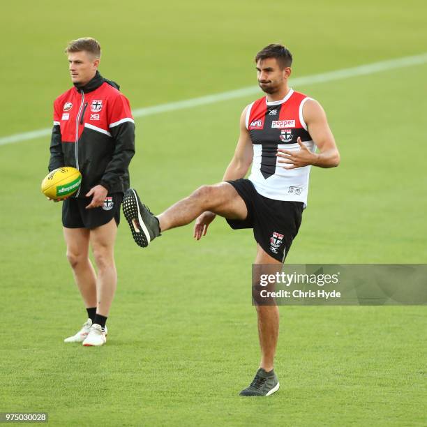 Billy Longer kicks during a St Kilda Saints AFL training session at Metricon Stadium on June 15, 2018 in Gold Coast, Australia.