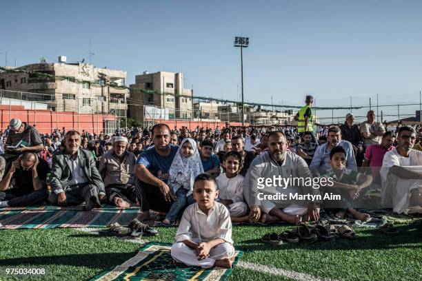 Jordanian Muslims gather to perform Eid al-Fitr prayer on June 15. 2018 in Amman, Jordan. Eid al-Fitr is celebrated by Muslims to mark the end of...