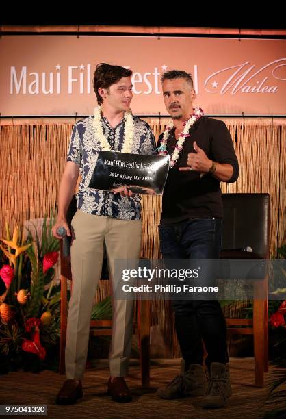 Colin Farrell presents the Rising Star Award to Nick Robinson at the 2018 Maui Film Festival on June 14, 2018 in Wailea, Hawaii.