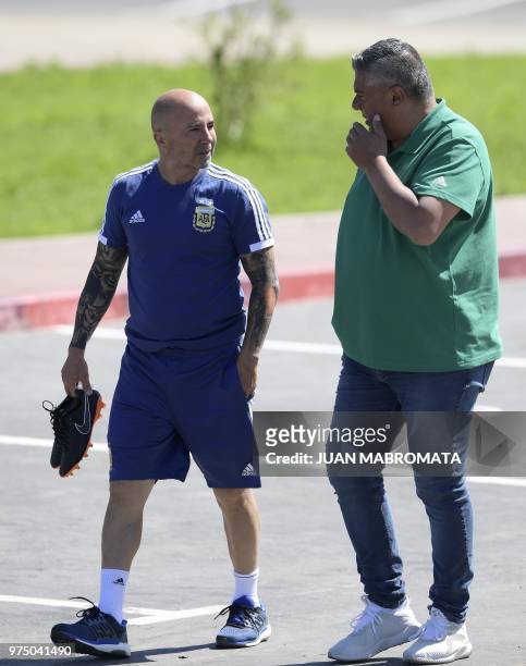 Argentina's football federation president Claudio Tapia talks to coach Jorge Sampaoli as they arrive for a training session at the team's base camp...