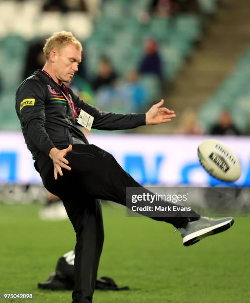 Peter Wallace of the Panthers kicks a ball in the warm up during the round 15 NRL match between the Sydney Roosters and the Penrith Panthers at...