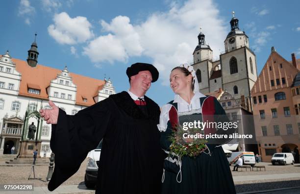 May 2018, Germany, Lutherstadt Wittenberg: Ivette Winkler in the role of Katharina von Bora and Klaus Pohl as Martin Luther standing on the...