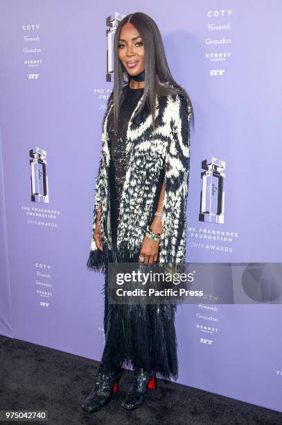 Naomi Campbell wearing dress by Alexander McQueen attends 2018 Fragrance Foundation Awards at Alice Tully Hall at Lincoln Center.