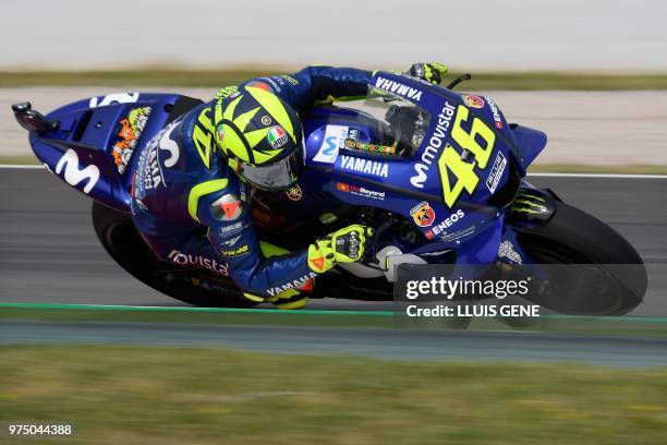 Movistar Yamaha MotoGP's Italian rider Valentino Rossi takes a curve during the Catalunya MotoGP Grand Prix first free practice session at the...