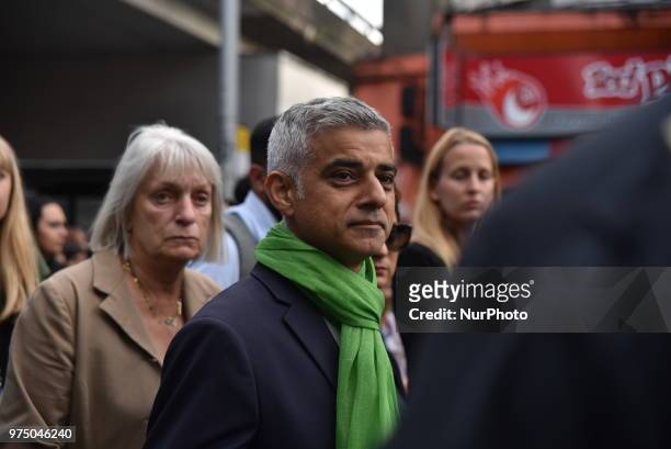 Mayor of London Sadiq Khan join a silent march to St Mark's Park where an open Iftar will take place on the one year anniversary of the Grenfell...
