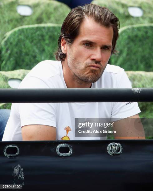 Former German player Tommy Haas watches the match between Denis Istomin of Uzbekistan and Lucas Pouille of France during day 5 of the Mercedes Cup at...