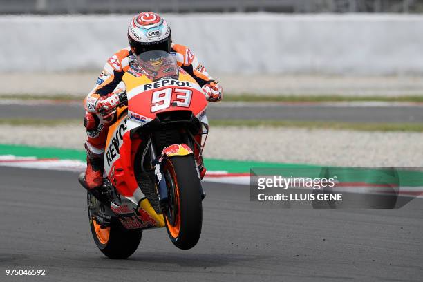 Repsol Honda's Spanish rider Marc Marquez practices the race start during the Catalunya MotoGP Grand Prix first free practice session at the...