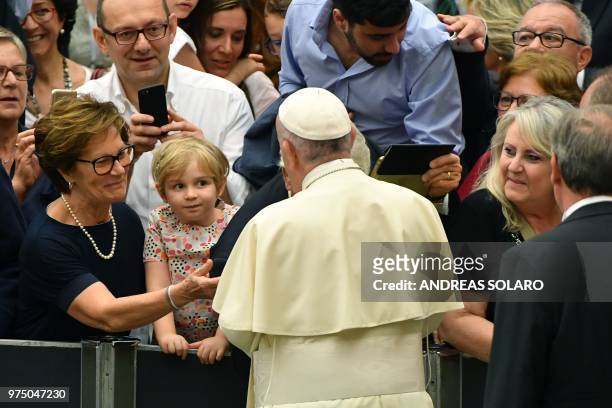 Pope Francis greets faithful during his audience of participants in the National Congress of the Italian Masters of Labor Federation, in Aula Paolo...