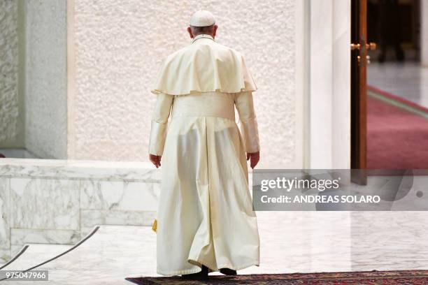 Pope Francis leaves at the end of his audience of participants in the National Congress of the Italian Masters of Labor Federation, in Aula Paolo VI...