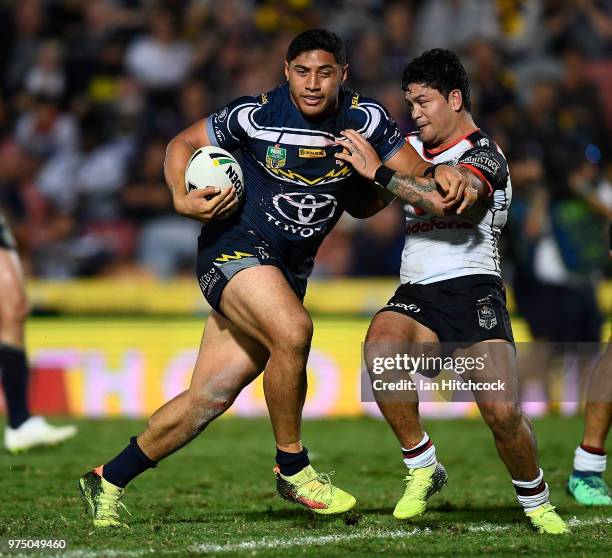 Jason Taumalolo of the Cowboys is tackled by Issac Luke of the Warriors during the round 15 NRL match between the North Queensland Cowboys and the...